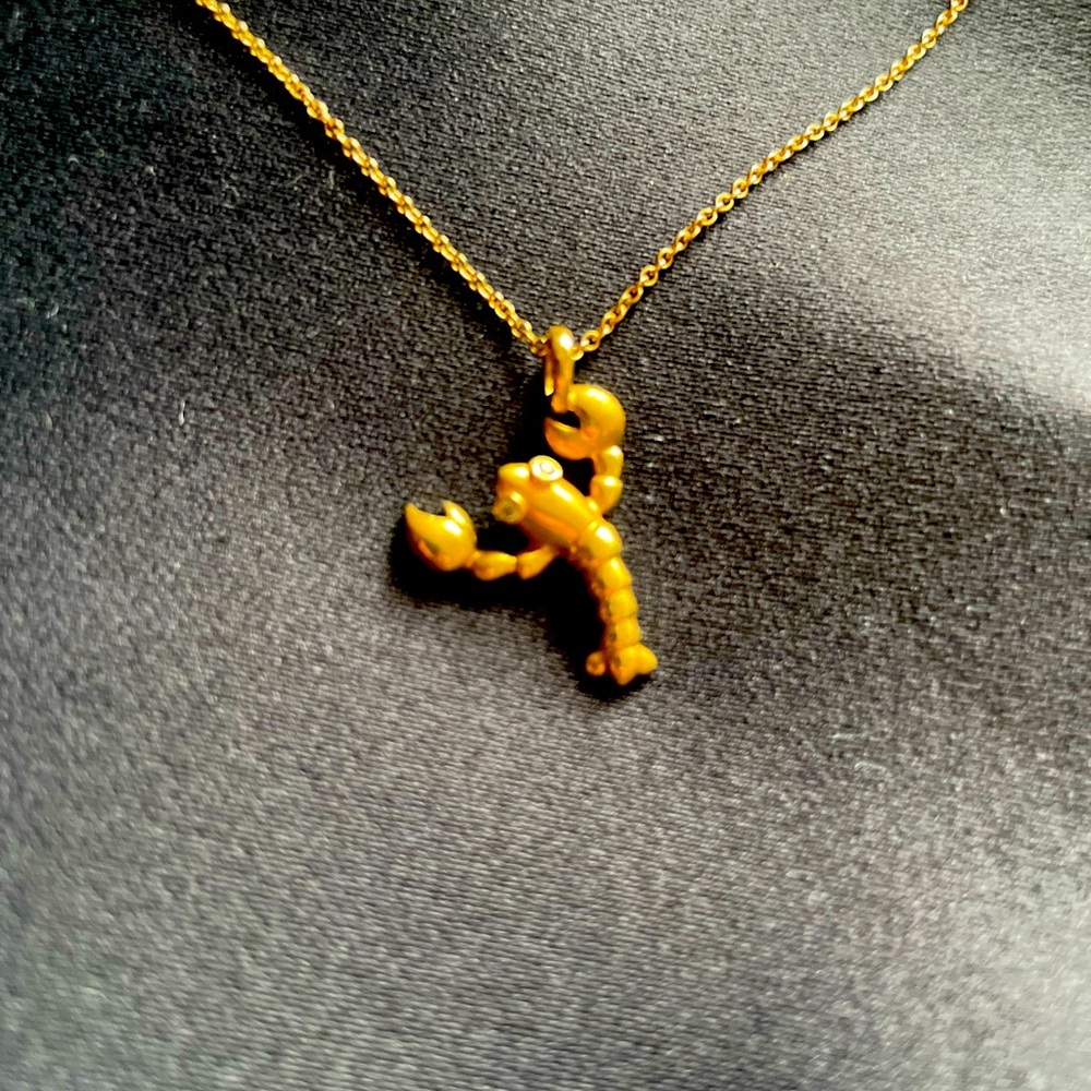 Tiffany & Co 18k solid yellow gold lobster charm with diamond eyes.
